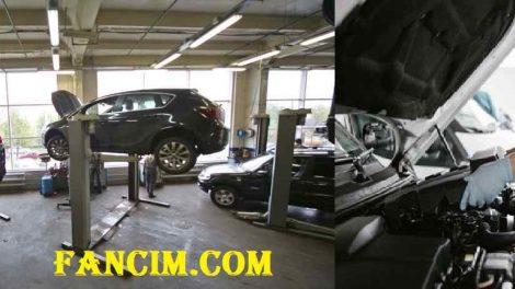 Car mechanic working in a car workshop